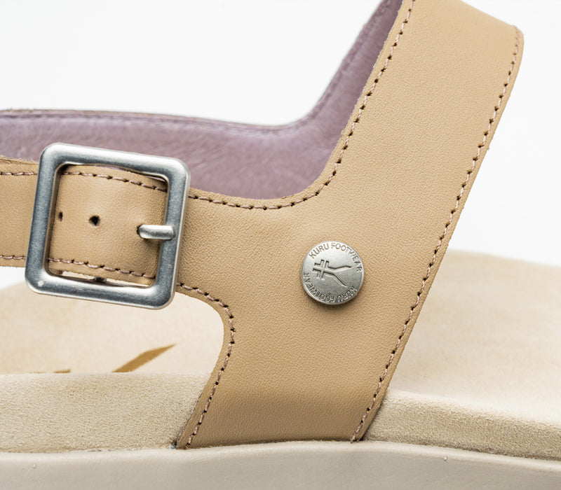 Close-up of the buckle on the KURU Footwear GLIDE Women's Sandal in Taupe-Metallic