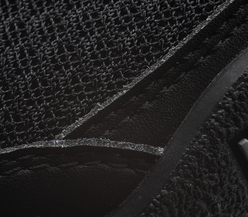 Close-up of the material on the KURU Footwear DRAFT Men's Slipper in JetBlack